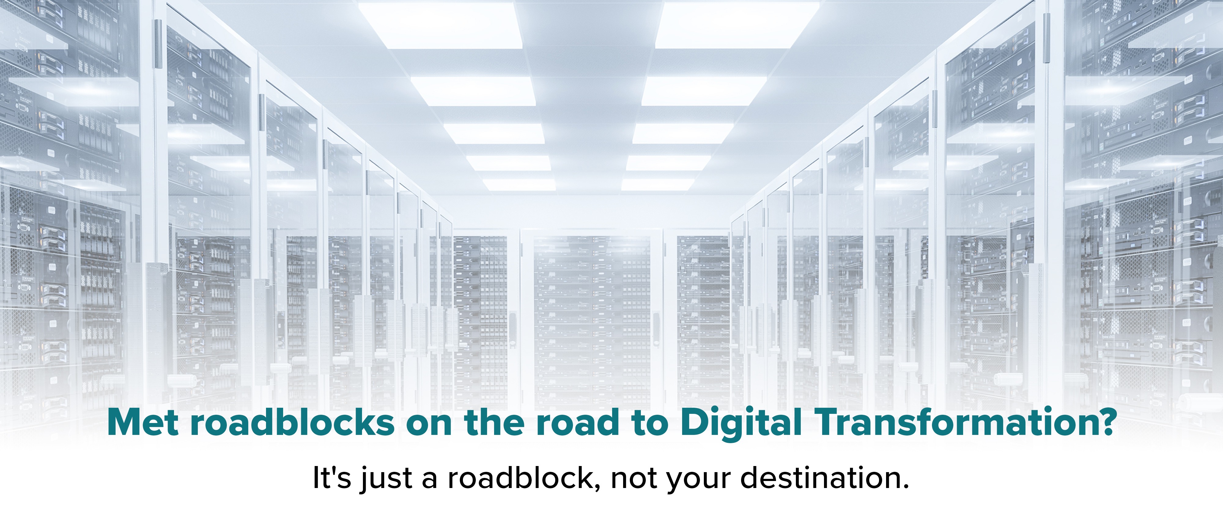 Old mainframe room. Text reads ' Met roadblocks on the road to Digital Transformation? It's just a roadblock, not your destination.'